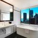 Deluxe Corner King Bathroom
 - Amora Hotel Jamison