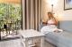 Relaxing in the living space of the villa
 - Tranquil Getaways on Obi Maleny
