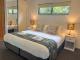 King bed in deluxe villa
 - Tranquil Getaways on Obi Maleny